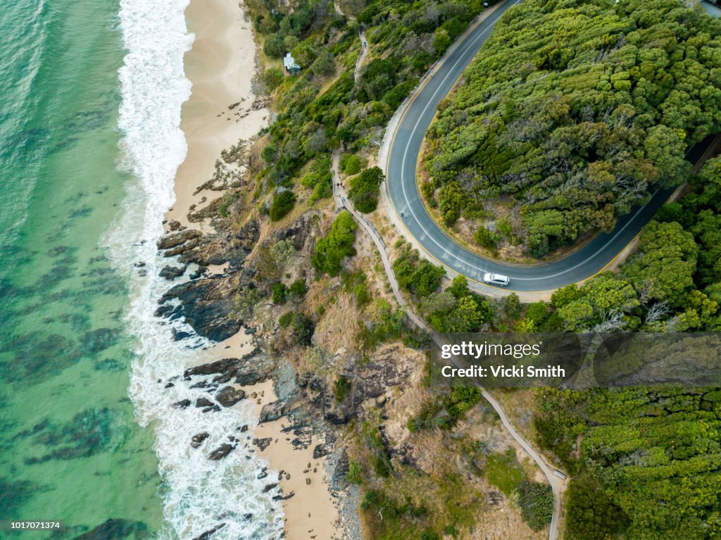 Rocky outcrop into ocean with road