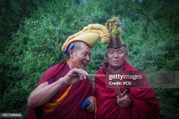 Tibetan Buddhist monks light incense on the first day of the traditional Sho Dun Festival at Drepung Monastery on August 11, 2018 in Lhasa, Tibet...