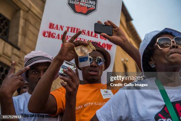 The Food and Allied Workers Union and civil organizations march from Church Square to the National Treasury demanding help in fighting illicit crime...