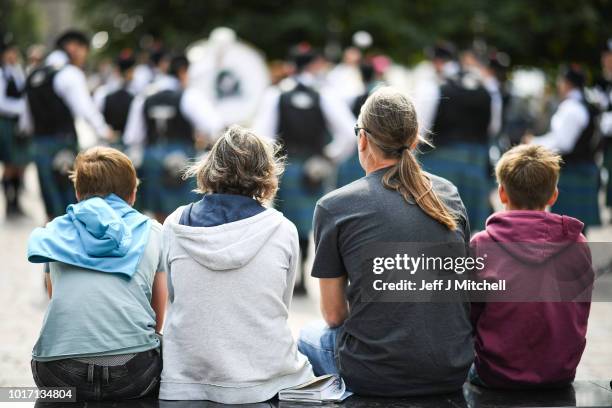 People watch the Scottish Society of New Zealand play in Buchanan street during the Piping Live Glasgow International Piping Festival on August 15,...