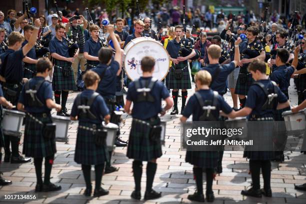 Scots College Pipes and Drums from Sydney, Australia play in Buchanan street during the Piping Live Glasgow International Piping Festival on August...