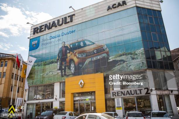 Renault SA automobile dealership advertises the Dacia Duster SUV in its windows in the Bayrampsa district of Istanbul, Turkey, on Wednesday, Aug. 14,...