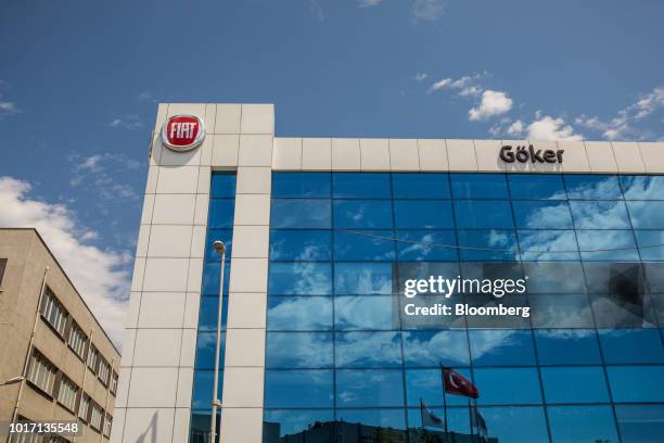 The logo of Fiat automobiles sits on display outside the Goker Fiat Chrysler Automobiles NV dealership in the Bayrampsa district of Istanbul, Turkey,...