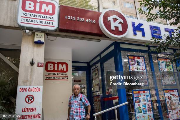 Customer exits a BIM discount supermarket in Istanbul, Turkey, on Wednesday, Aug. 14, 2018. Turkey has slapped an additional tax on imports of a...