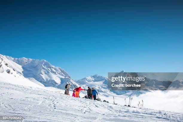 friends having a snack on ski splope - vanoise national park stock pictures, royalty-free photos & images