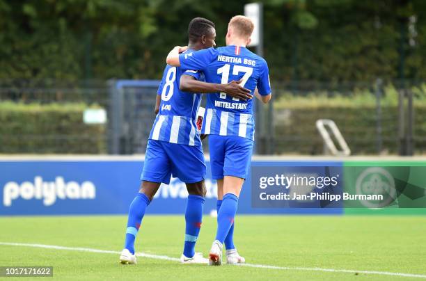 Salomon Kalou and Maximilian Mittelstaedt of Hertha BSC celebrate after scoring the 3:0 during the game between Hertha BSC and Hallescher FC at the...
