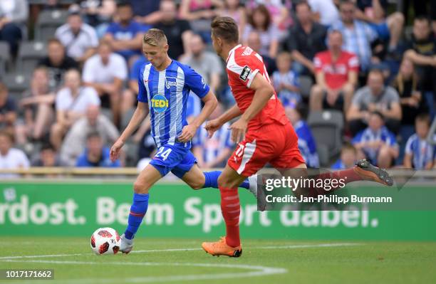 Palko Dardai of Hertha BSC and Erik Henschel of Hallescher FC compete for the ball during the game between Hertha BSC and Hallescher FC at the...