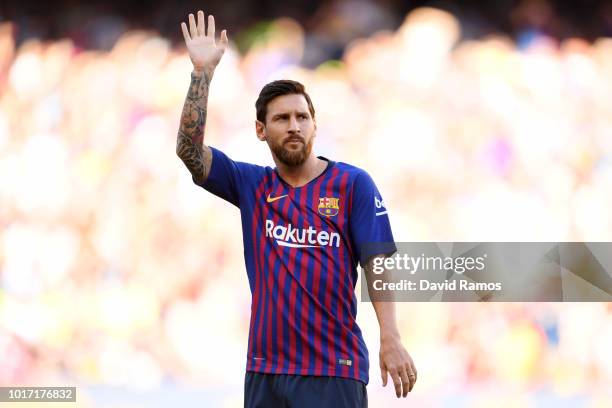 Lionel Messi of Barcelona waves to the fans ahead of the Joan Gamper Trophy between FC Barcelona and Boca Juniors at Camp Nou on August 15, 2018 in...