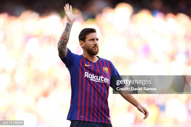 Lionel Messi of Barcelona waves to the fans ahead of the Joan Gamper Trophy between FC Barcelona and Boca Juniors at Camp Nou on August 15, 2018 in...