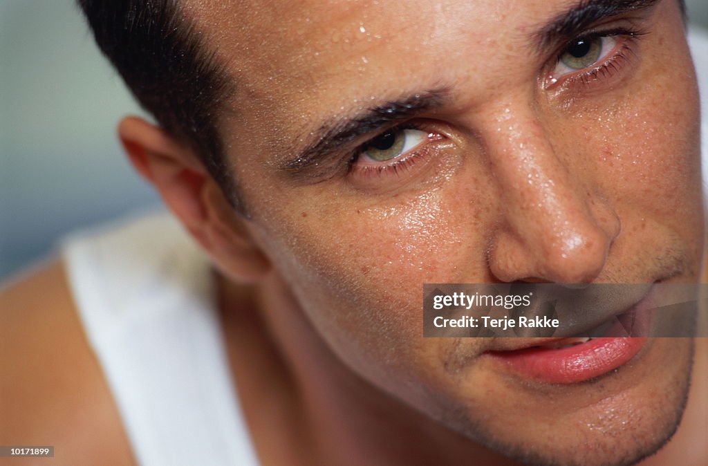 MAN IN GYM, CLOSE UP