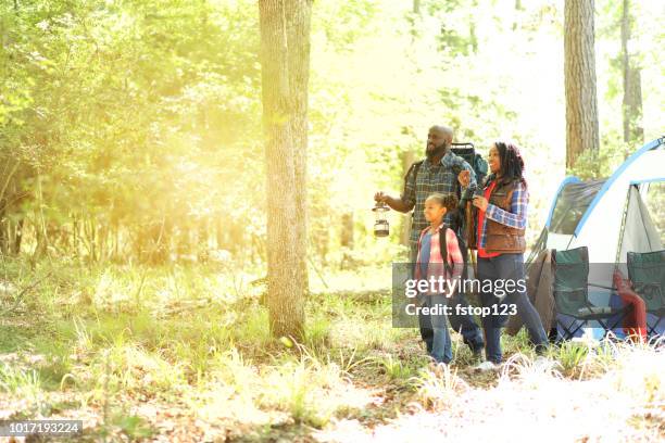 family on summer or autumn vacation camping in forest. - texas family stock pictures, royalty-free photos & images