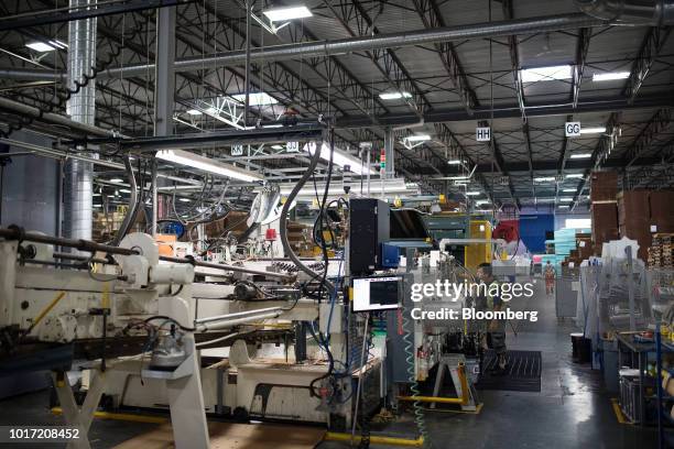 An employee prepares a box assembly machine at the Great Little Box Co. Manufacturing facility in Vancouver, British Columbia, Canada, on Friday,...