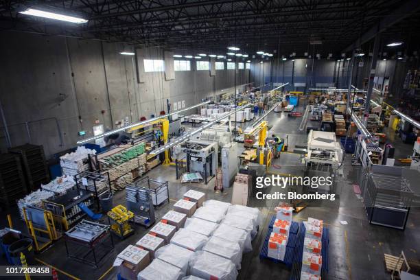 Employees work on the floor at the Great Little Box Co. Manufacturing facility in Vancouver, British Columbia, Canada, on Friday, Aug. 10, 2018....