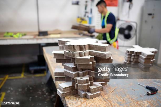 Pre-cut specialty packaging sits on a table at the Great Little Box Co. Manufacturing facility in Vancouver, British Columbia, Canada, on Friday,...