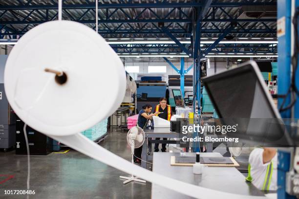 An employee prepares a foam packaging template at the Great Little Box Co. Manufacturing facility in Vancouver, British Columbia, Canada, on Friday,...