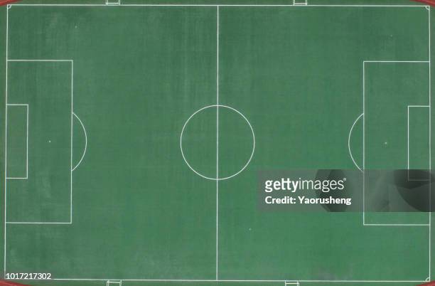 aerial view of a football field from above. - grass court stock-fotos und bilder