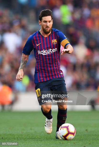Lionel Messi of FC Barcelona runs with the ball during the Joan Gamper Trophy match between FC Barcelona and Boca Juniors at Camp Nou on August 15,...