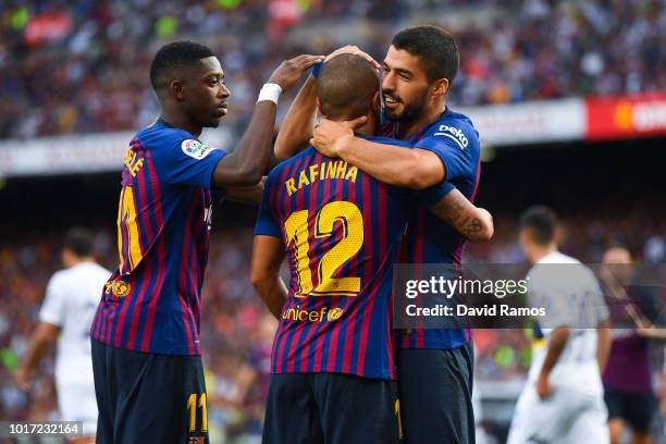 Rafinha Alcantara of FC Barcelona celebrates with his team mates Oussame Dembele and Luis Suarez of FC Barcelona after scoring his team's third goal...