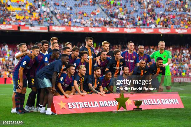 Barcelona players celebrate with the trophy after winning the Joan Gamper Trophy match between FC Barcelona and Boca Juniors at Camp Nou on August...