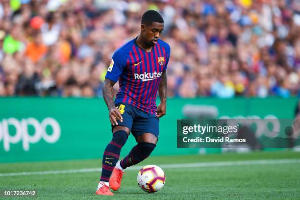 Malcom of FC Barcelona runs with the ball during the Joan Gamper Trophy match between FC Barcelona and Boca Juniors at Camp Nou on August 15, 2018 in...