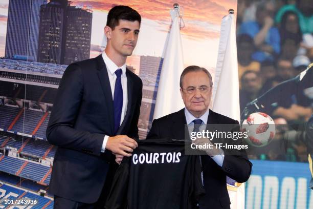 President Florntino Perez of Real Madrid and Thibaut Courtois of Real Madrid pose during the presentation at Estadio Santiago Bernabeu on August 9,...