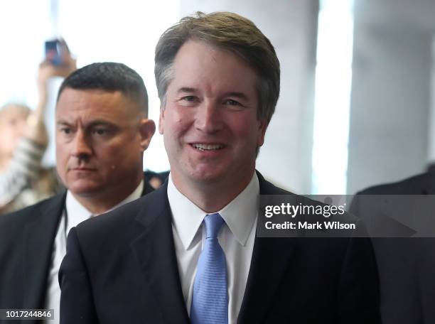 Supreme Court Justice nominee Judge Brett Kavanaugh walks to a meeting with Sen. Heidi Heitkamp in the Hart Senate Office Building, on August 15,...