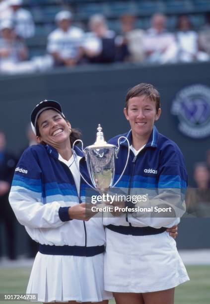 Gigi Fernandez of the USA and Natasha Zvereva of Belarus pose with the trophy after defeating Nicole Arendt of the USA and Manon Bollegraf of the...