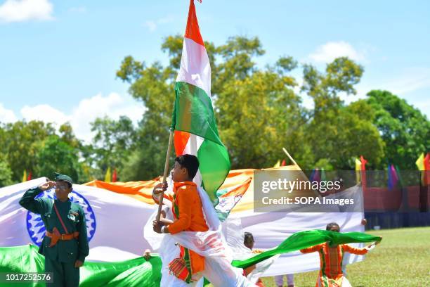 School students seen performing with flags. Different school students performed on the occasion of the 72nd Independence Day at Agartala, capital of...