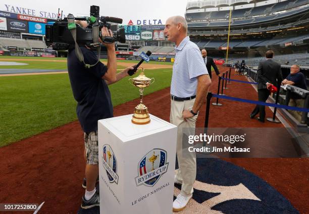 United States Ryder Cup Captian Jim Furyk gives an interview to a member of the media prior to a game between the New York Yankees and the New York...