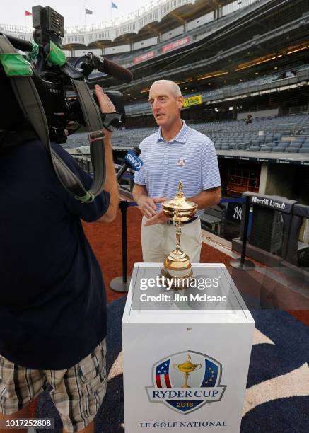 United States Ryder Cup Captian Jim Furyk gives an interview to a member of the media prior to a game between the New York Yankees and the New York...