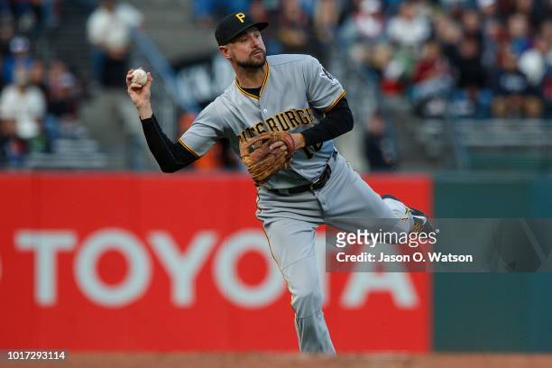 Jordy Mercer of the Pittsburgh Pirates throws to first base against the San Francisco Giants during the first inning at AT&T Park on August 10, 2018...