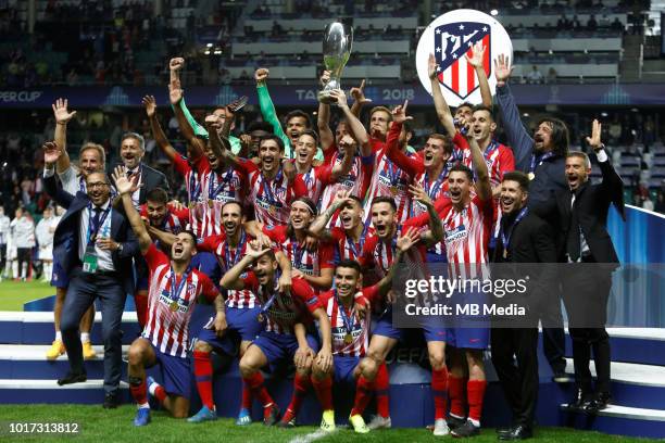 Atletico Madrid players celebrate with the trophy after the UEFA Super Cup match between Real Madrid and Atletico Madrid at Lillekula Stadium on...