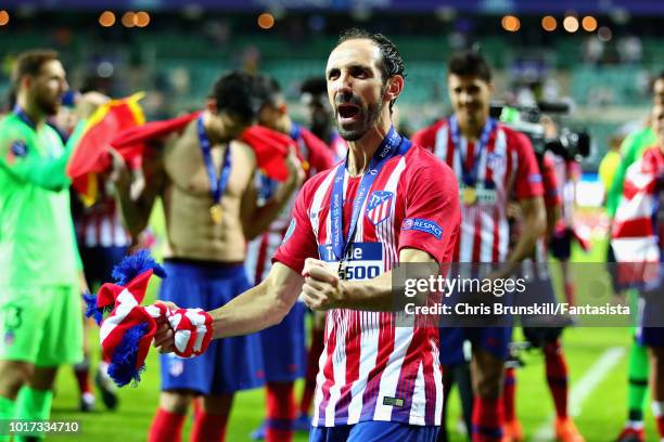 Juanfran of Atletico Madrid celebrates after winning the UEFA Super Cup between Real Madrid and Atletico Madrid at Lillekula Stadium on August 15,...