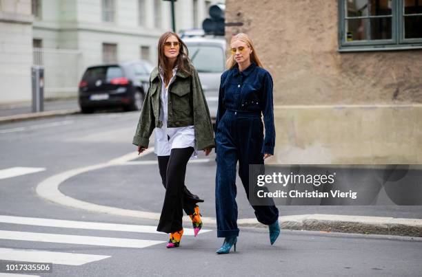 Darja Barannik wearing black pants, green jacket, white button shirt and Tine Andrea wearing corduroy pants and button shirt seen outside Moire...