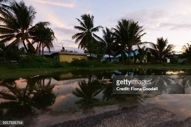 Rising sea levels cause flooding at high tide near the airport runway on August 15, 2018 in Funafuti, Tuvalu. The small South Pacific island nation...