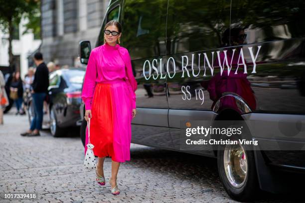 Darja Barannik wearing pink dress is seen outside Line of Oslo during Oslo Runway SS19 on August 15, 2018 in Oslo, Norway.