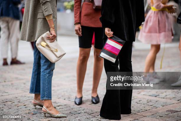 Guest wearing Balenciaga bag seen outside Michael Olestad during Oslo Runway SS19 on August 15, 2018 in Oslo, Norway.