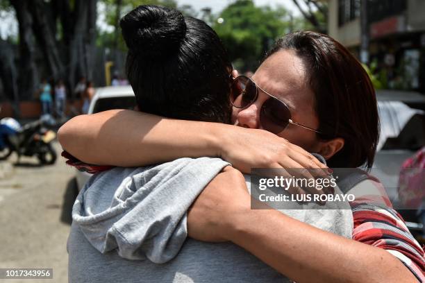 Relatives of some of the 19 Colombian victims involved in a bus accident in Ecuador that left 24 dead, meet on August 15, 2018 in Cali, Colombia, to...