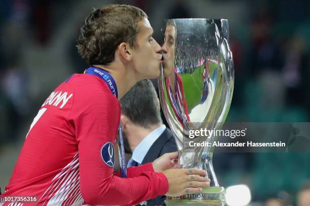 Antoine Griezmann of Atletico Madrid celebrates with the trophy following the UEFA Super Cup between Real Madrid and Atletico Madrid at Lillekula...