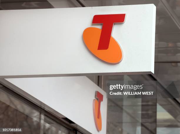 The sign of telecommunications company Telstra is seen at one of its branches in Melbourne on August 16, 2018. - Australia's dominant...