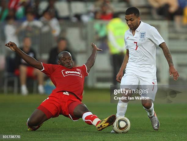 Miro of Platinum Stars tackles Aaron Lennon of England during the friendly match between England and Platinum Stars at the Moruleng Stadium on June...