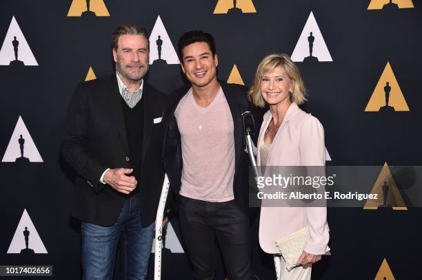 John Travolta, Mario Lopez and Olivia Newton-John attend the Academy Presents "Grease" 40th Anniversary at the Samuel Goldwyn Theater on August 15,...