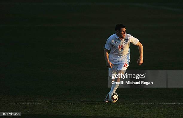 James Milner of England runs on the ball during the friendly match between England and Platinum Stars at the Moruleng Stadium on June 7, 2010 in...