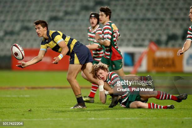 Caleb Leef of Takapuna Grammar offloads the ball during the North Harbour First XV Final between Westlake Boys andTakapuna Grammar at QBE Stadium on...