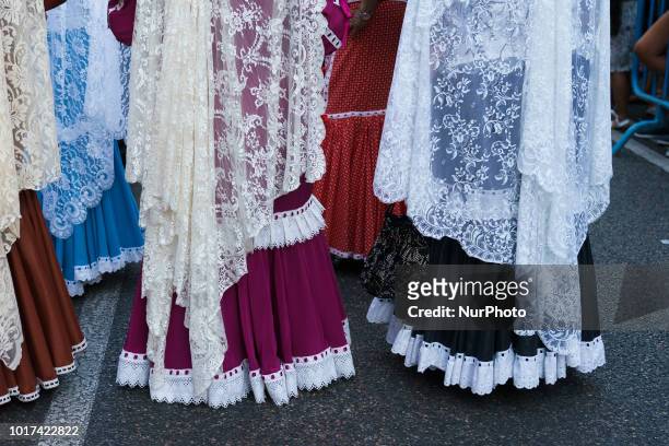 Women dressed in Madrid's traditional attire 'Chulapos' attend the Feast of La Paloma Virgin in Madrid, spain on August 15, 2018. - Madrid's history...