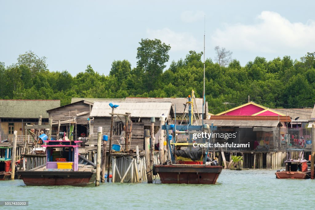 A view of a fishermen's village on stilts besides the sea in Pulau Ketam (Crab Island). This island is famous for sea food products and restaurants.