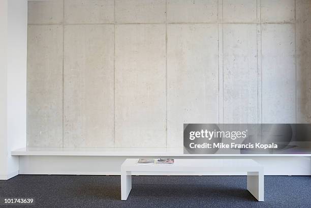 bench and table in modern office lobby - lobby foto e immagini stock