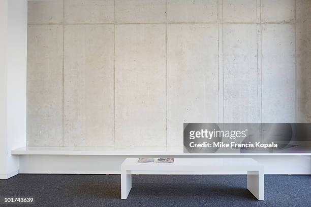 bench and table in modern office lobby - lobby stock pictures, royalty-free photos & images