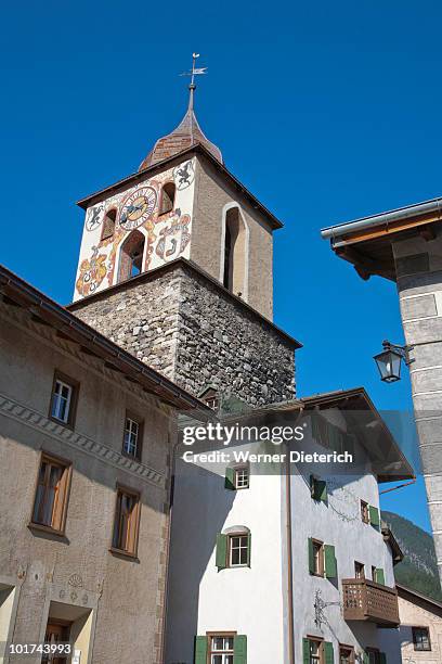 switzerland, grisons, engadin, village of guarda with chuch and steeple, elevated view - guarda switzerland fotografías e imágenes de stock