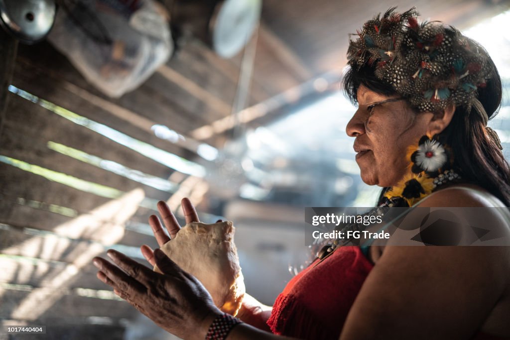 Indigenous Brazilian Woman, from Guarani Ethnicity, Cooking "Xipa"